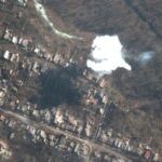 A satellite image shows smoke from recently dropped ordnance, amid