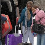 Asylum seekers cross into Canada from Roxham Road in Champlain