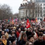 French unions and workers march against pension reforms in Paris