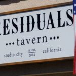 The sign of Residuals Tavern is seen outside the bar